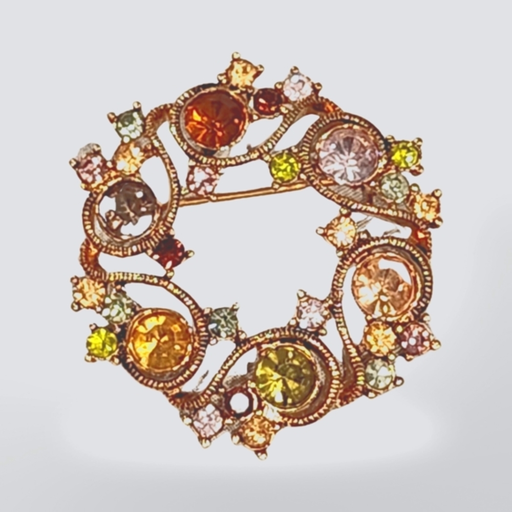 Lovely vintage‎ Monet gold tone multi colored rhinestone circle brooch
